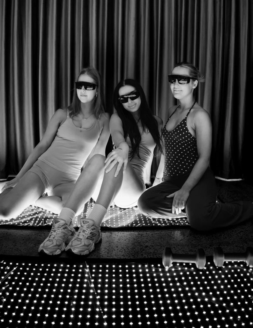 Three guests wearing sunglasses at an Atlas brand event