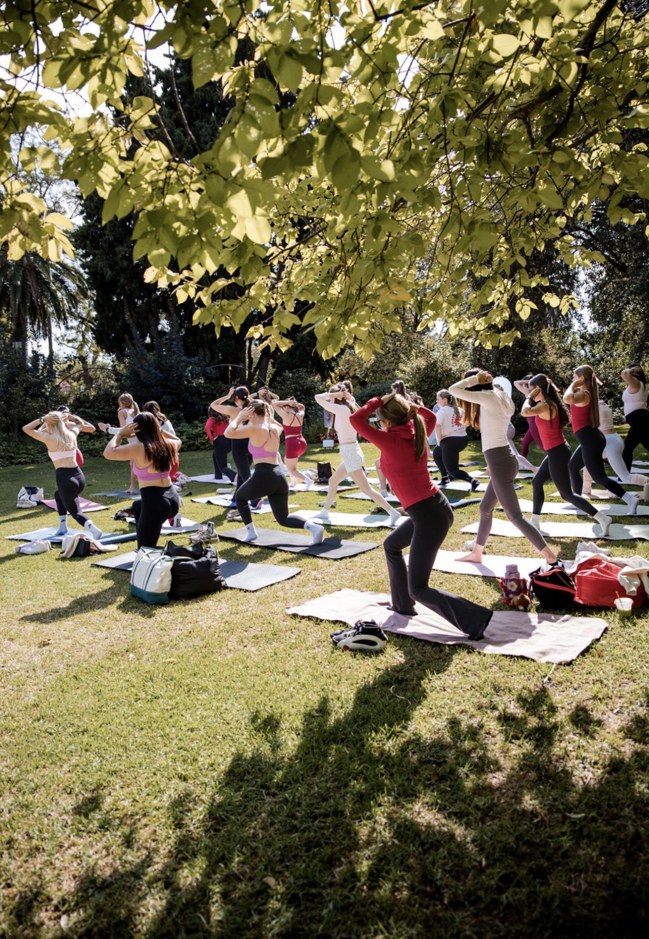 Group Pilates experience by a pool