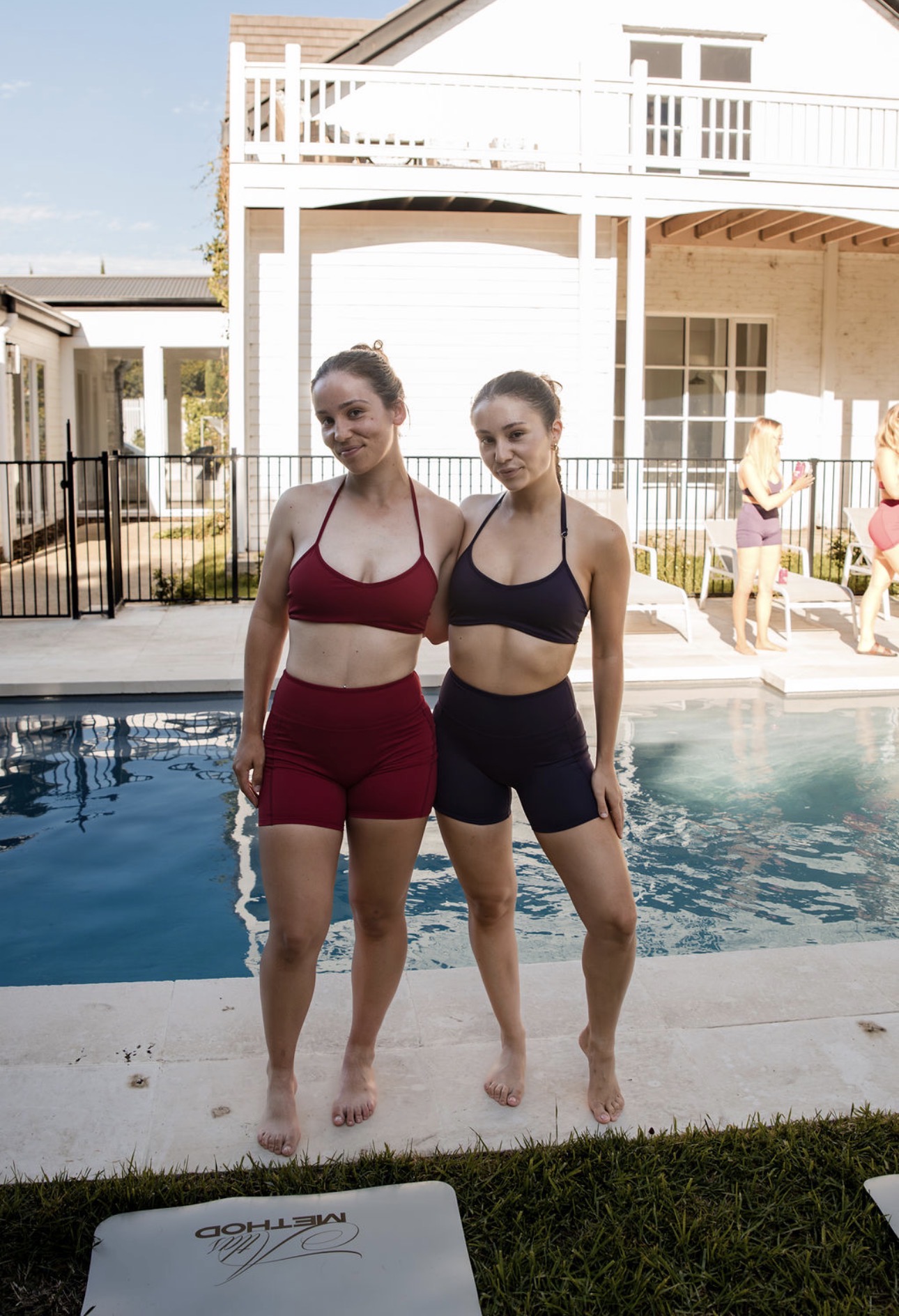 Group Pilates experience by a pool